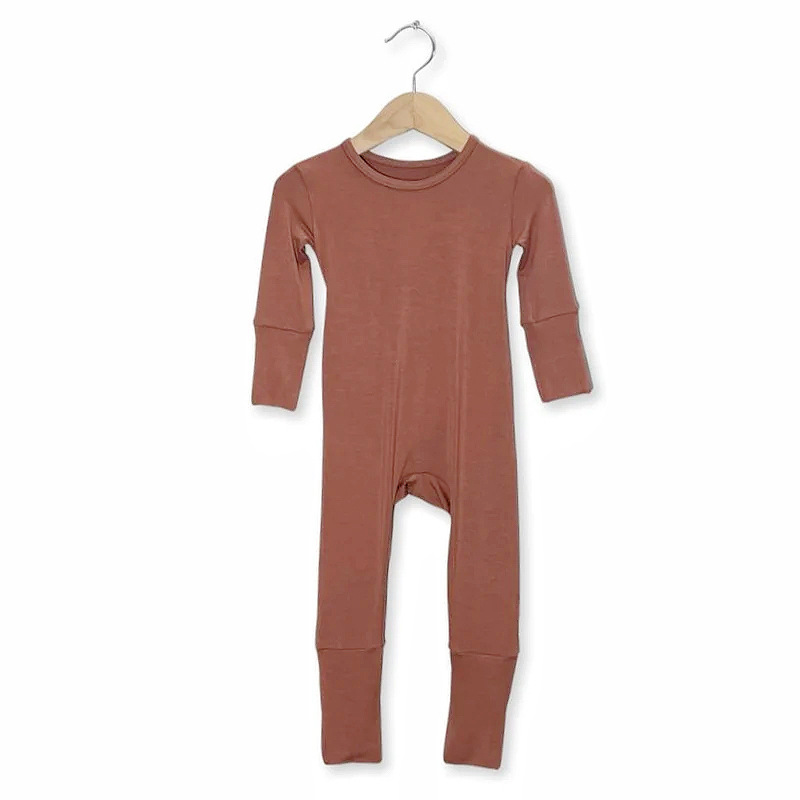 Wholesale sustainable bamboo sleepwear for babies featuring a girl romper, ideal for eco-conscious retailers seeking quality and style.