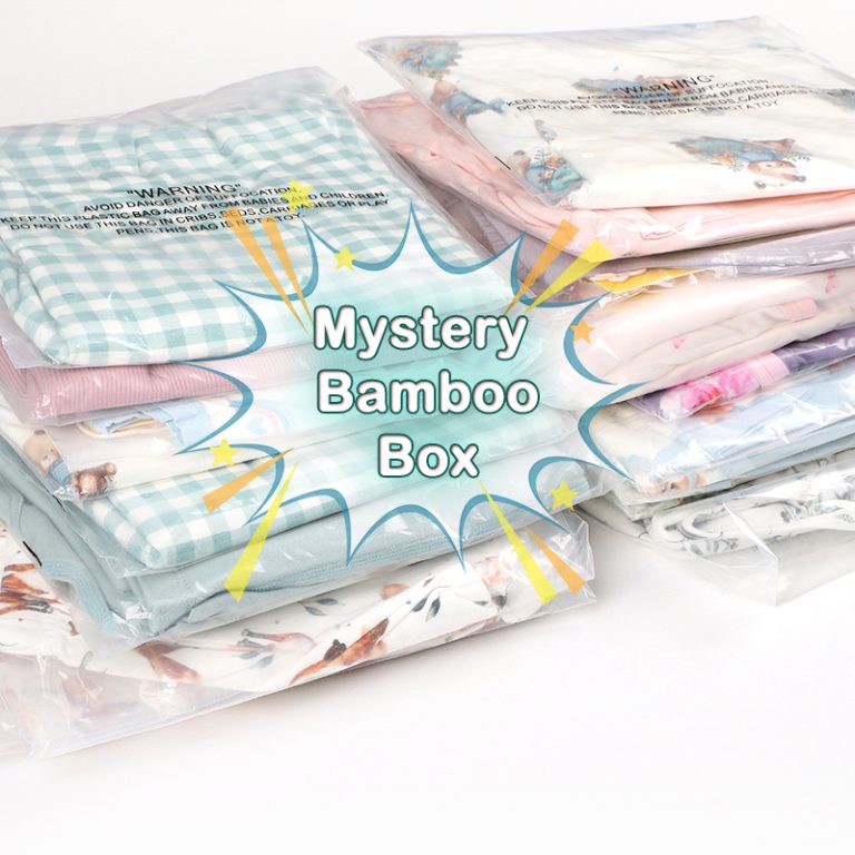 Rainbow butterfly pattern on custom knitted bamboo baby clothing by Weiwei. Ideal for newborns. Available wholesale for autumn children's wear.